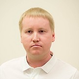 Врач Туганов Роман Андреевич